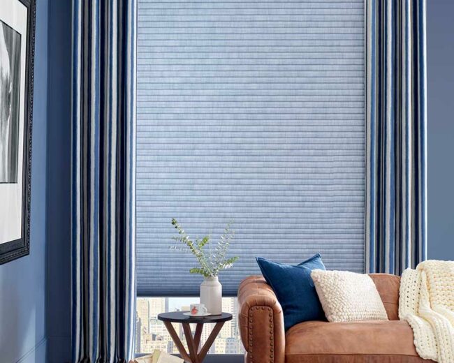 blue floor to ceiling window coverings with striped patterned for energy efficiency UV protection