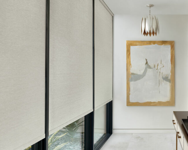 hallway with floor to ceiling windows and soft neutral roller screen shades with automated control