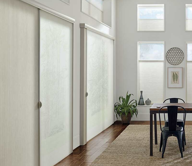 dining room with light control coming from vertical honeycomb shades window treatments