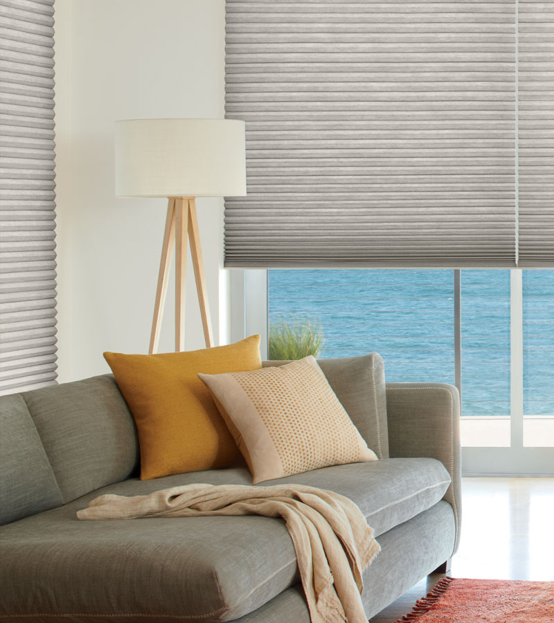 gray energy saving window shades next to gray couch