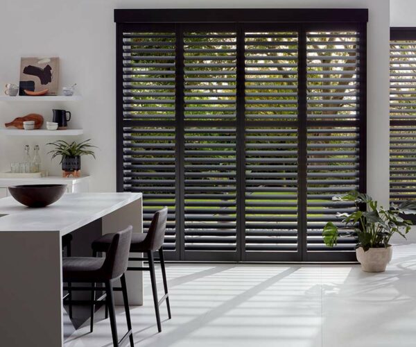 black shutters covering patio door in kitchen space