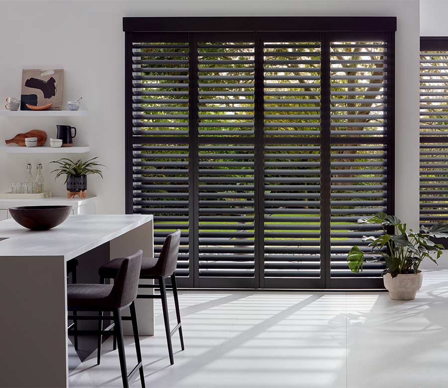 black shutters covering patio door in kitchen space