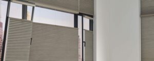 european windows with cellular shades in gray fabric