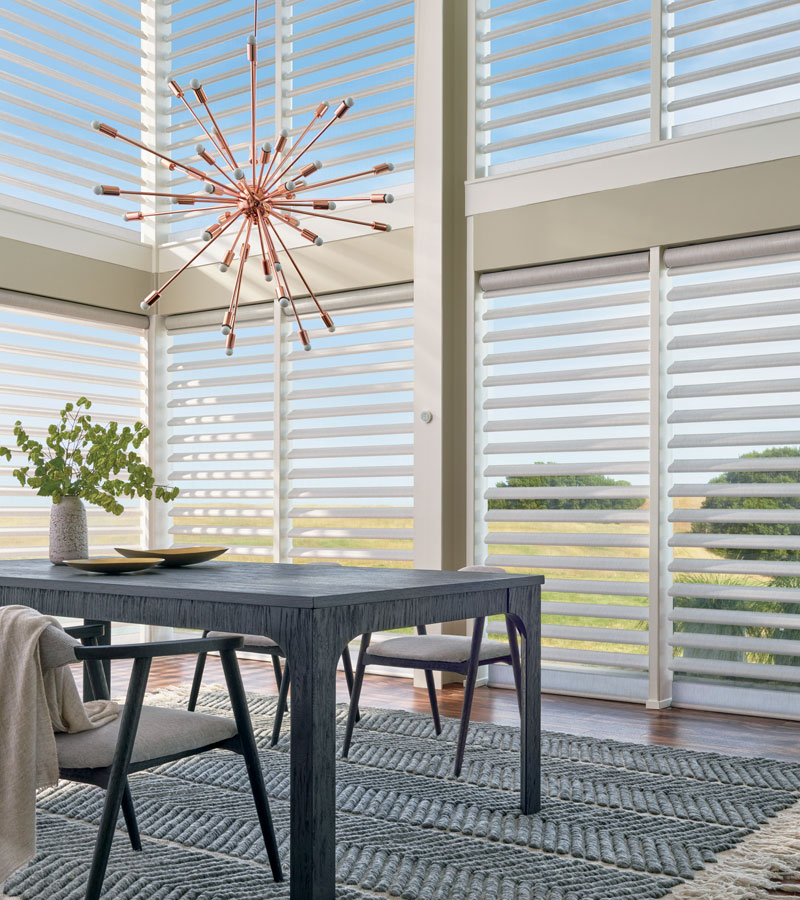 open window treatments on large windows overlooking backyard