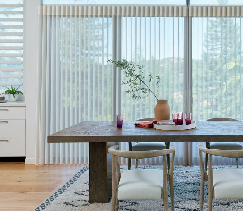 modern dining room in Omaha, NE with vertical privacy sheers large dining room table
