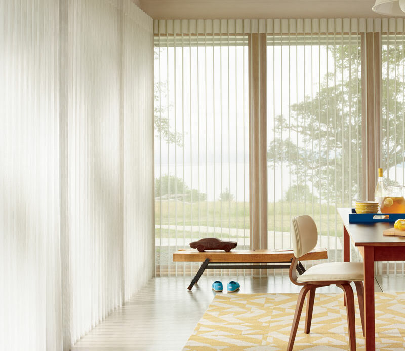 light dining room with vertical window treatments omaha, NE