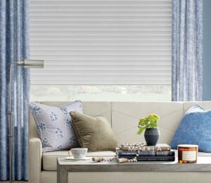 types of roller shades and window treatments ideas with drapery matching with couch pillows in omaha, NE home