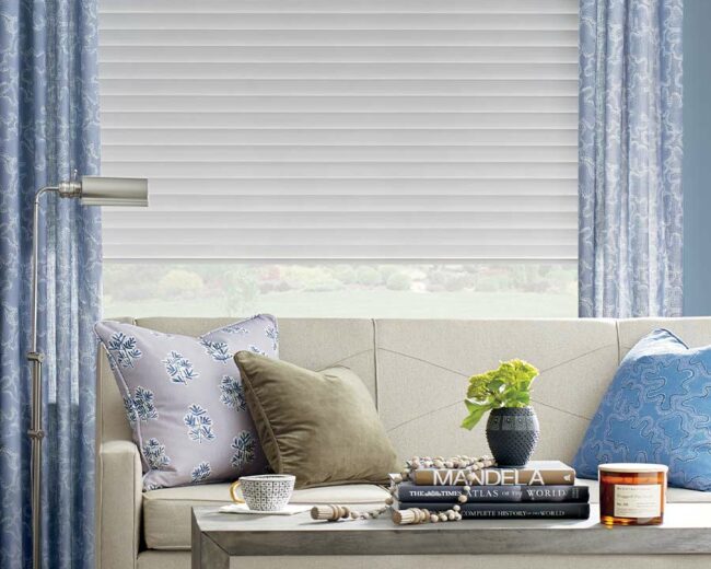 types of roller shades and window treatments ideas with drapery matching with couch pillows in omaha, NE home