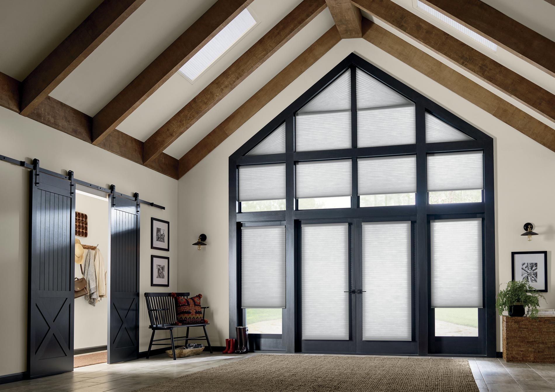 large entryway angled windows covered by gray cellular shades