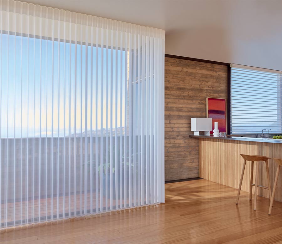 luminette sheer drapery covering large windows in kitchen bar area