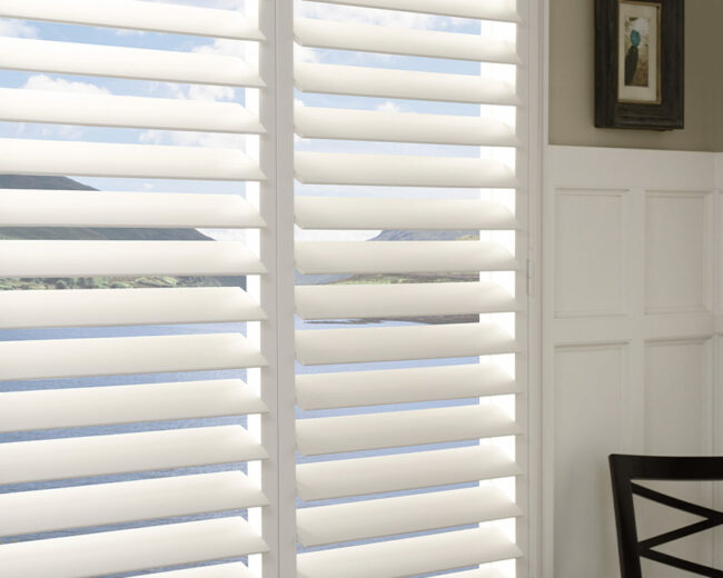 white traditional shutters for kitchen overlooking lake