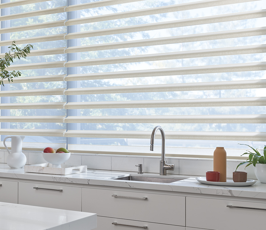 kitchen wall of windows behind sink with pirouette shades omaha