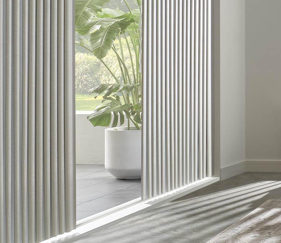 angled view of glass door with shadings looking into tropical garden space Omaha, NE