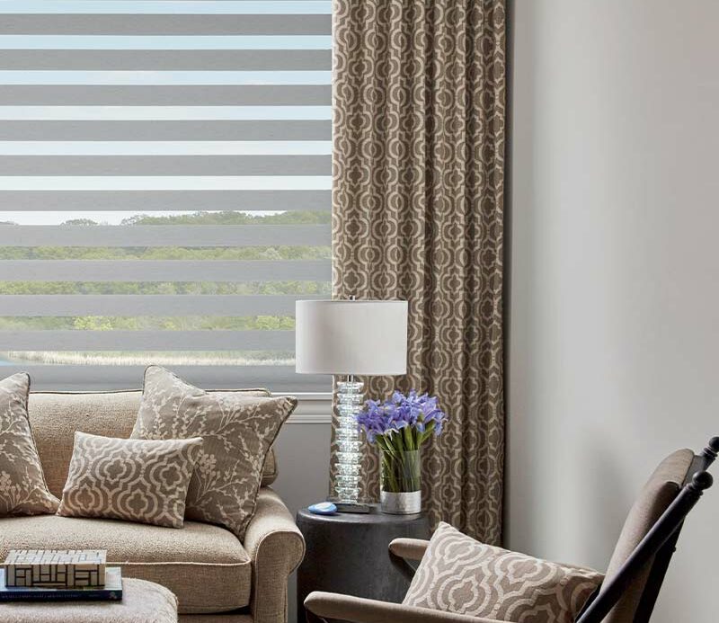 brown pattern drapery and gray banded window shades in Omaha, NE