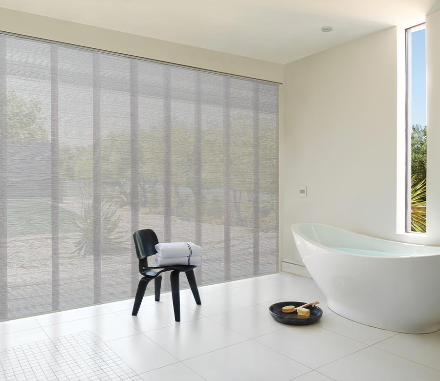 panel track blinds on floor to ceiling windows