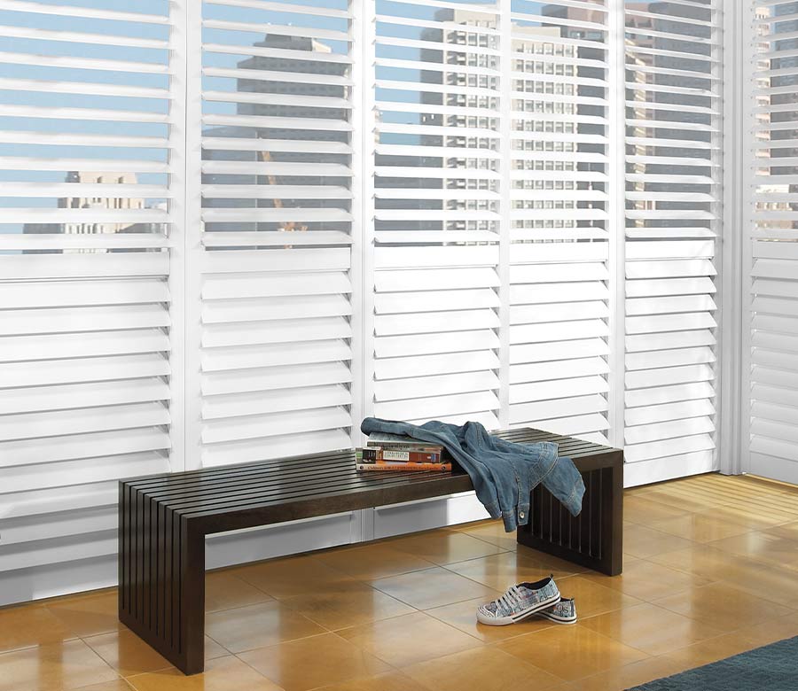 large window shutters white painted interior shutters