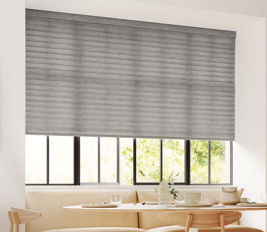 dining room with warm wood tones and breakfast nook window shade in slate gray fabric color