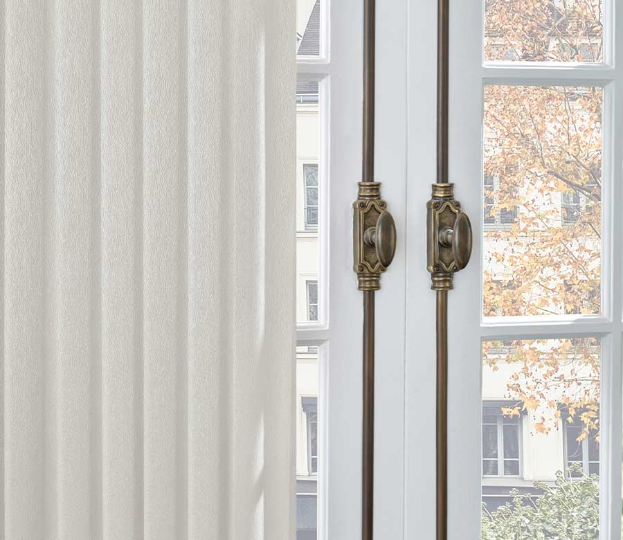 fabric vertical blinds door window coverings on french patio door in rustic cityscape