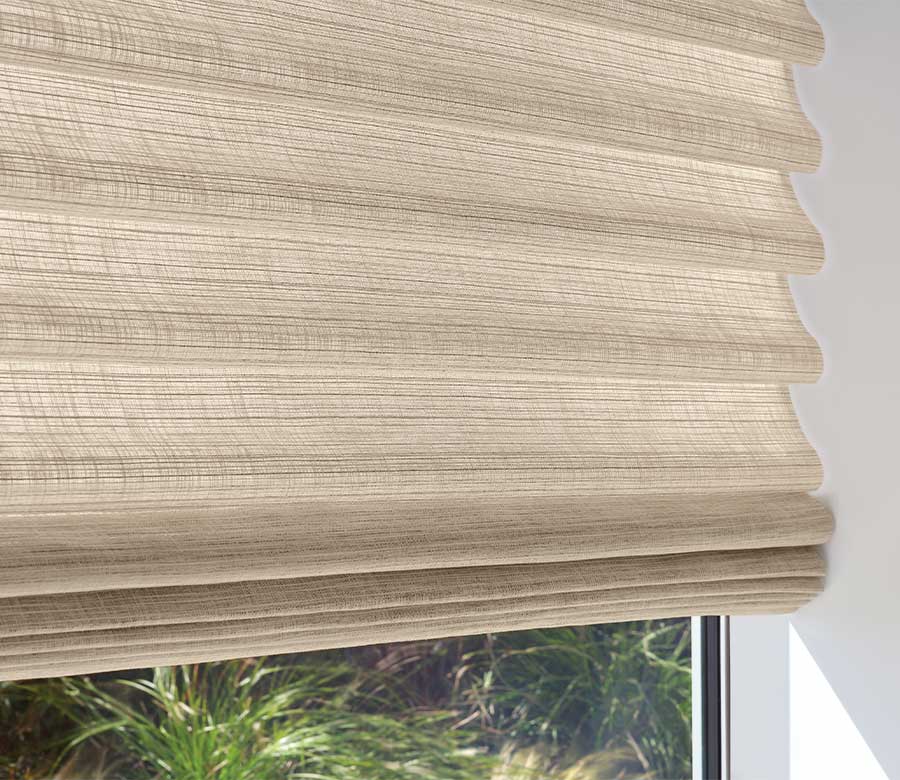 folding roman blinds in beige fabrics close up cordless